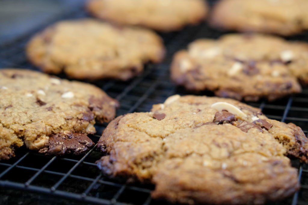 white chocolate chocolate cookie on a cooling rack