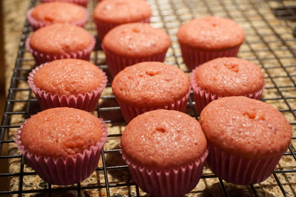 strawberry mini cupcakes on a cooling rack 