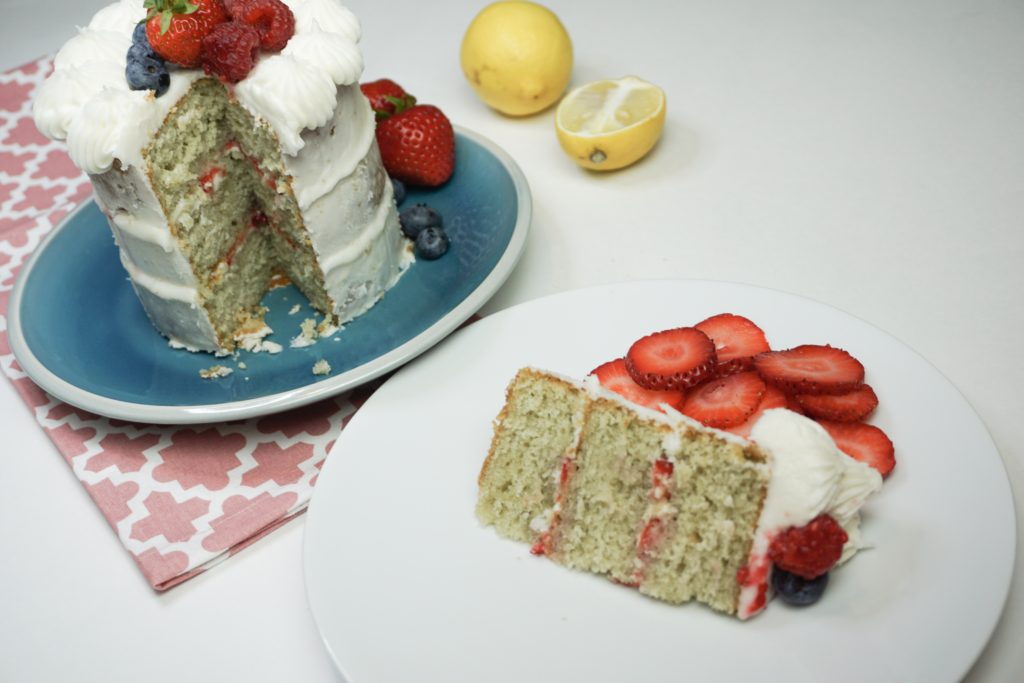 Sliced mini vanilla cake with thinly cut strawberries in the middle 