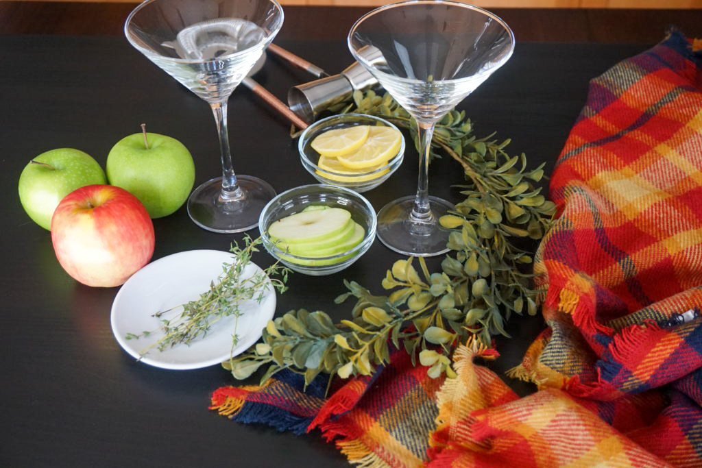 the ingredients and glasses for the cocktail 