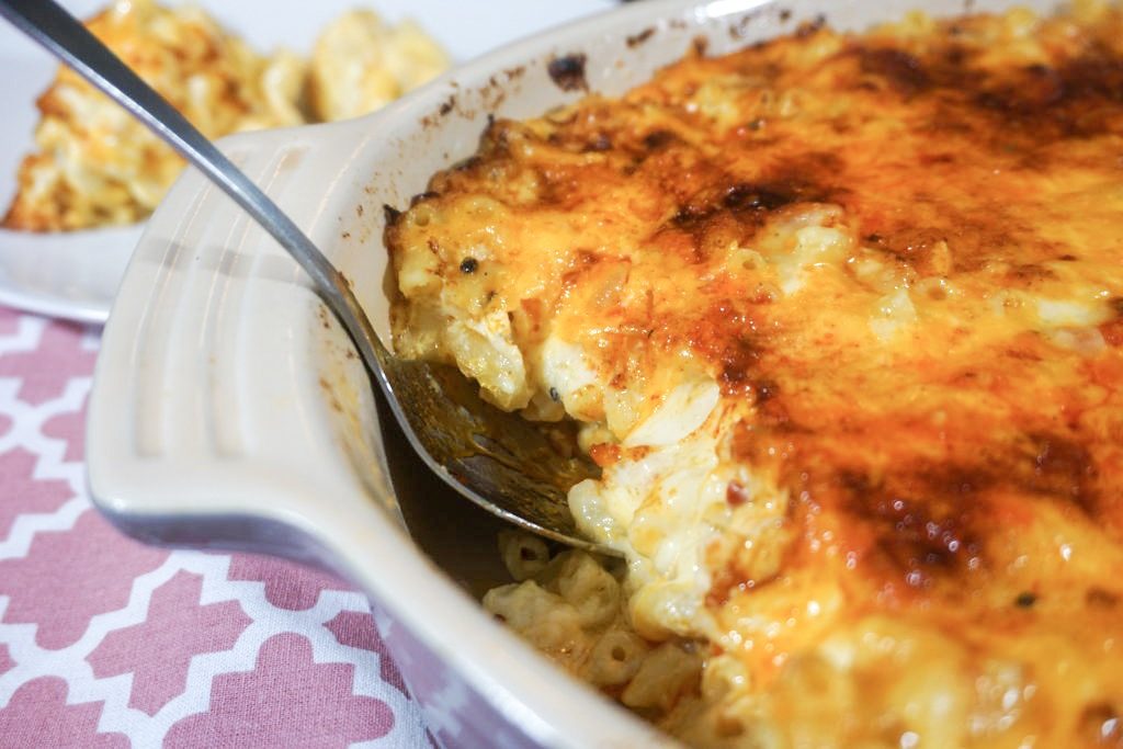 Baked mac and cheese close up into all its goodness