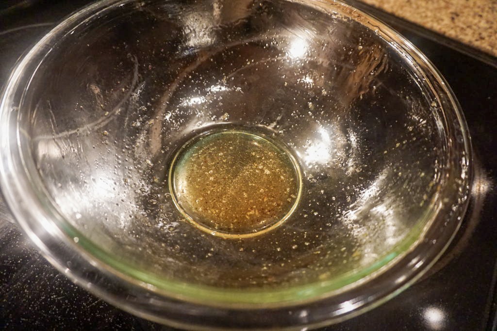 Greased glassed bowl with brown butter and garlic