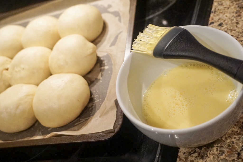 Before egg washing the brioche rolls 