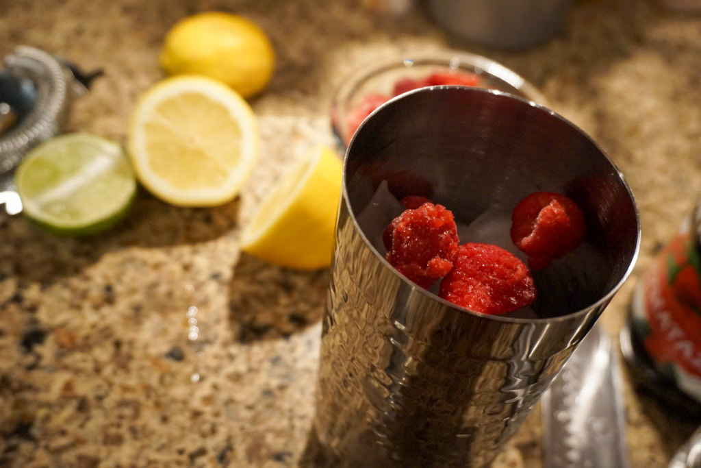 raspberries in a cocktail shaker 