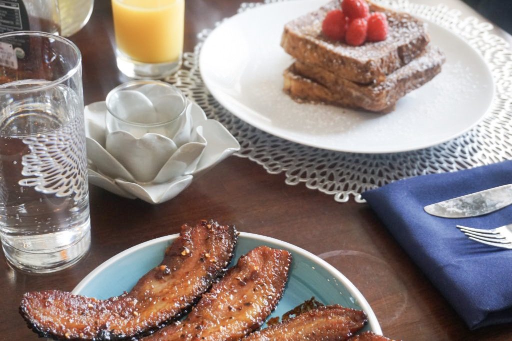 Cinnamon french toast with our spiced bacon and fresh orange juice