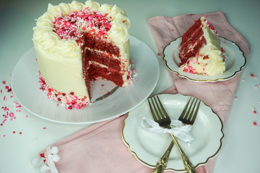 sliced and plated red velvet cake