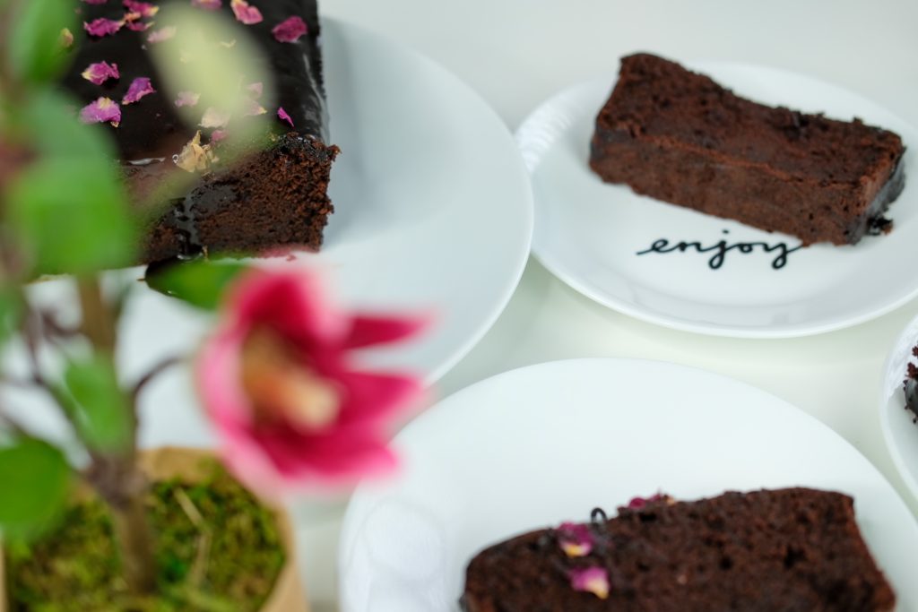 slices of chocolate pound cake on plates saying enjoy